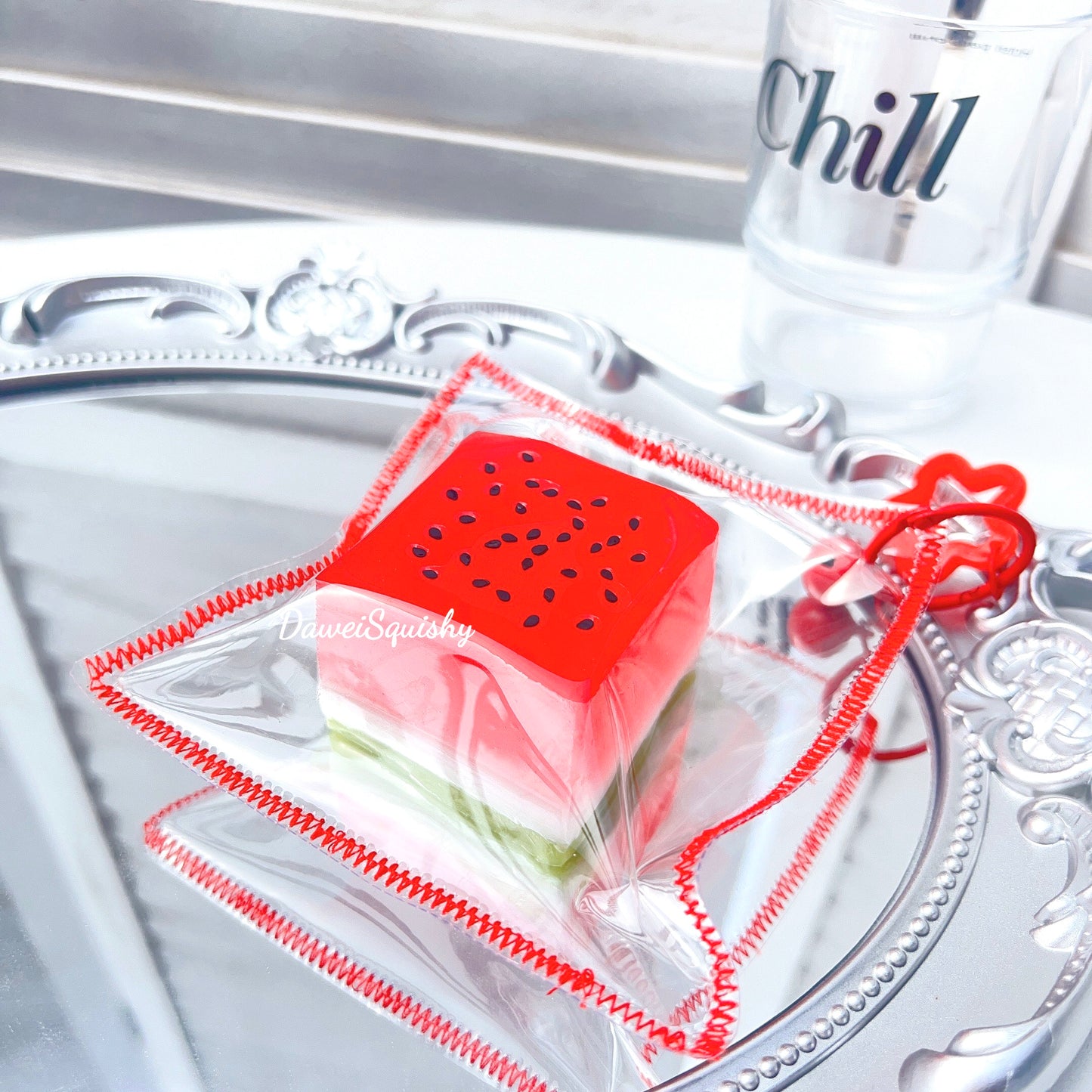CLEAR WATERMELON CUBE SQUISHY TOY
